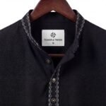 Jet black Pakistani-style Panjabi in premium self-textured jacquard fabric with elegant tonal embroidery on the band collar.