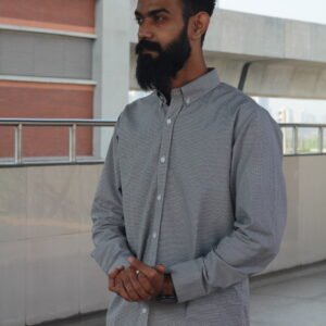 Man wearing a white premium textured striped shirt with sunglasses, standing outdoors near greenery and a sidewalk, styled for a modern yet traditional look.