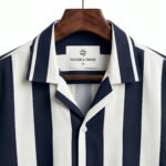 Shop the Navy and White Vertical Stripe Cuban Collar Shirt by Togor & Tweed. A versatile, premium men's short-sleeve button-up perfect for smart-casual and vacation looks. Upgrade your style today