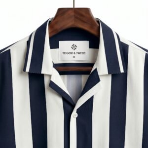 Shop the Navy and White Vertical Stripe Cuban Collar Shirt by Togor & Tweed. A versatile, premium men's short-sleeve button-up perfect for smart-casual and vacation looks. Upgrade your style today